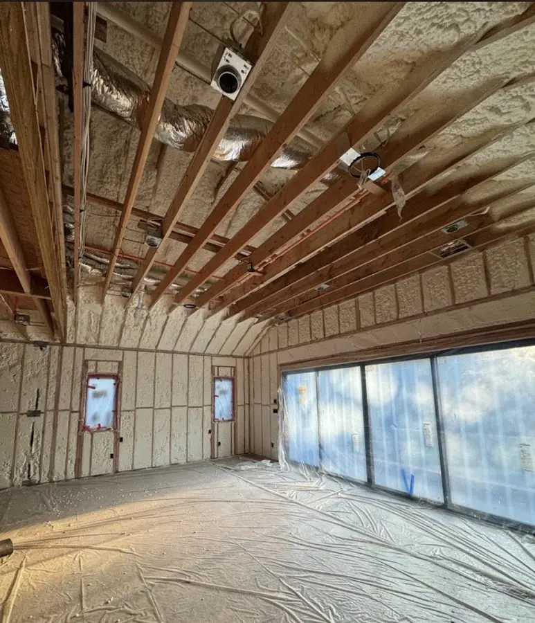 Interior walls and ceiling insulated with spray foam during new construction in Glen Cove
